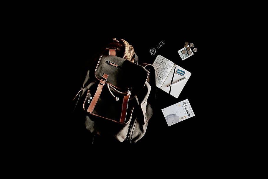 gray and brown bucket backpack beside book, travel, bag, notebook HD wallpaper
