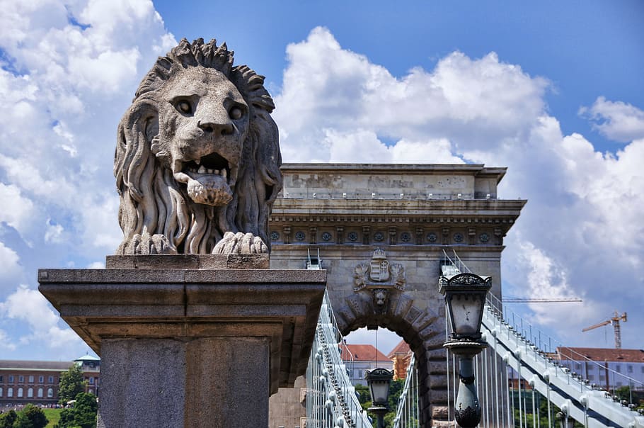 architectural photography of lion statue near arc, chain bridge HD wallpaper