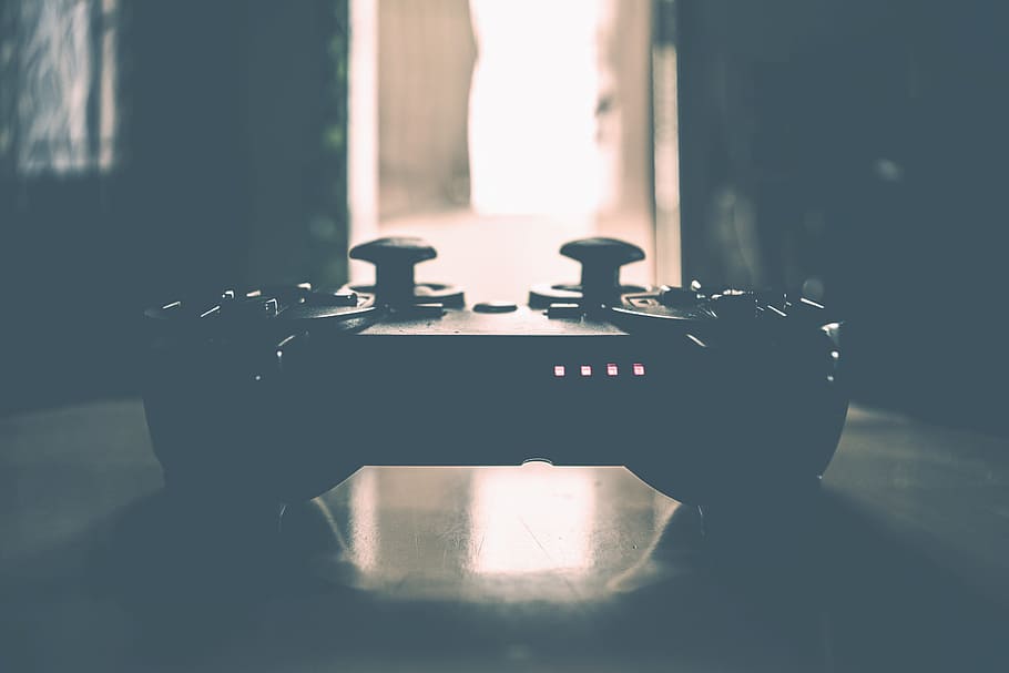 Closeup shot of video games controller, technology, indoors, people HD wallpaper