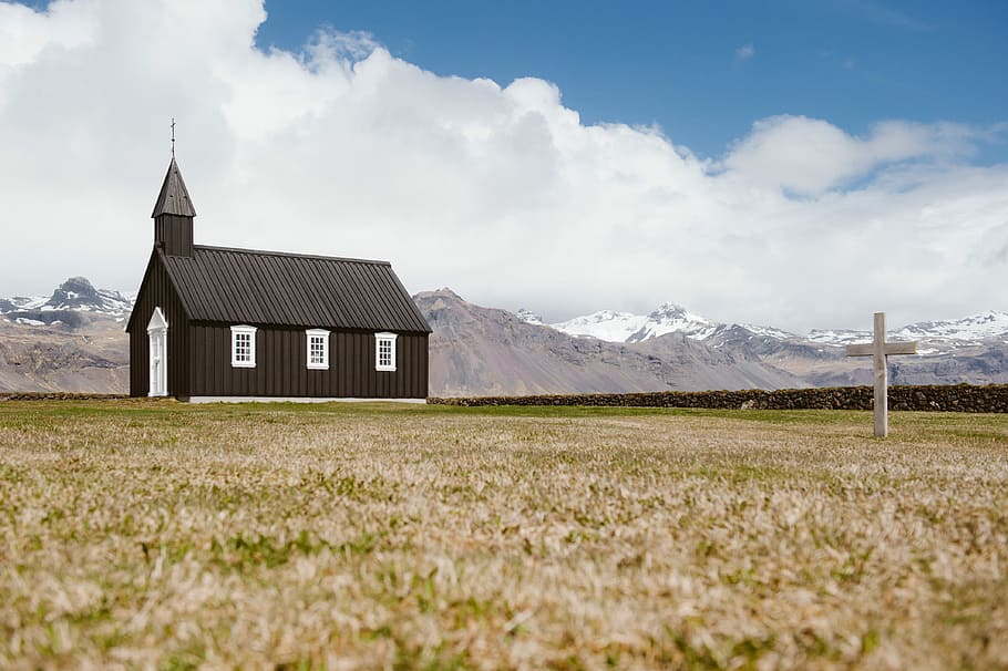 brown chapel during daytime, wooden cross struck near on church under cloudy sky HD wallpaper