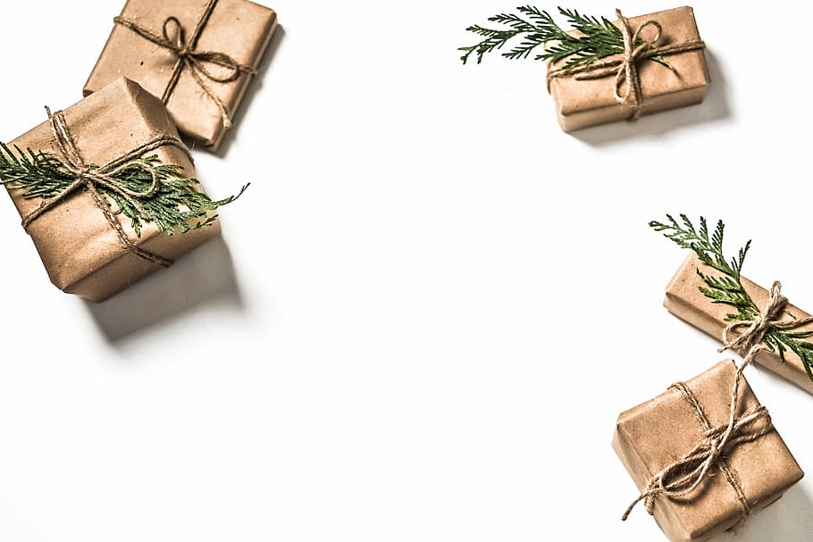 four brown gift boxes on white surface, five brown boxes with bows and leaves HD wallpaper