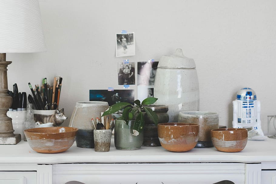 brown ceramic bowl on white wooden sideboard, assorted-color container lot HD wallpaper