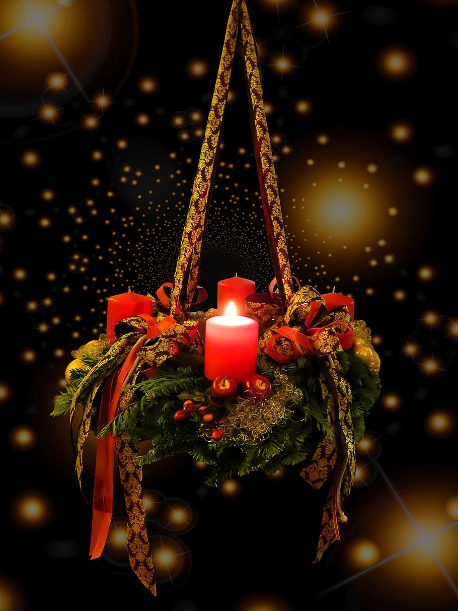 lighted red candle hanging on decor, advent, christmas time, advent wreath