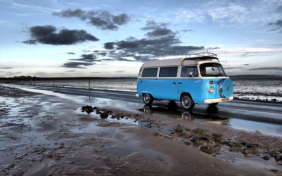 blue and white van on road near ocean during daytime, campervan