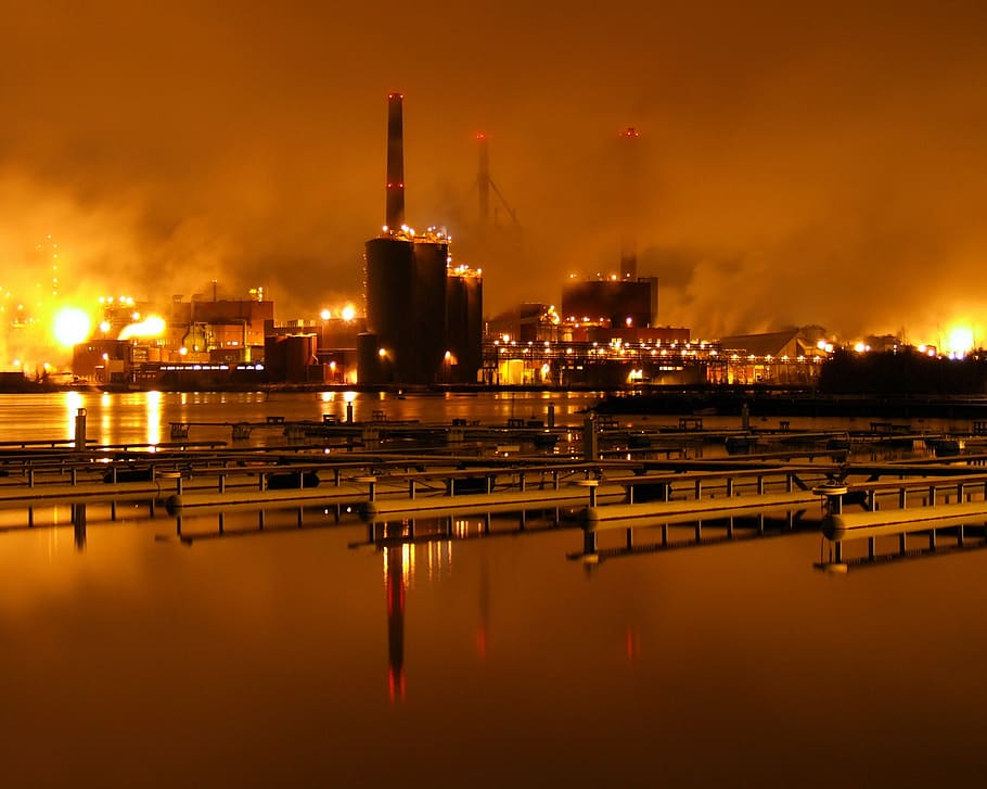 burned city near body of water, factory, night, paper mill HD wallpaper