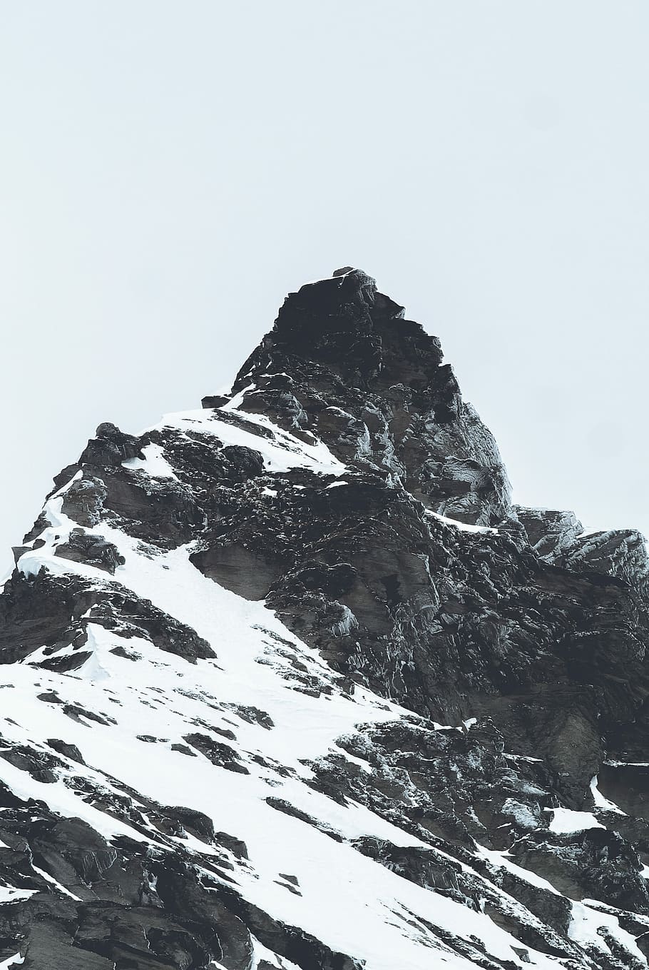 grayscale photo of a mountain, snow cover mountain during gray cloudy skies HD wallpaper