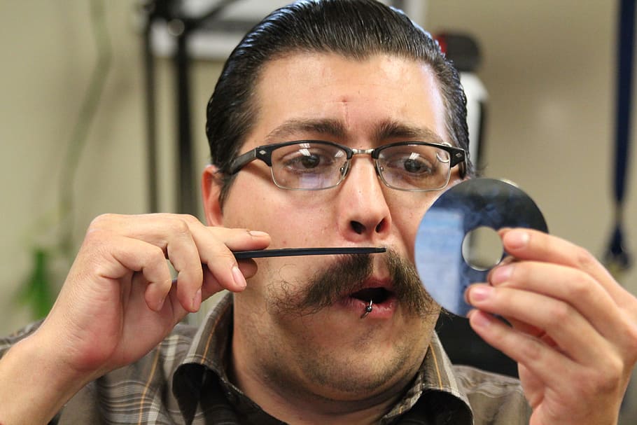 man trimming his beard at daytime, cd, reflective, disk, dvd HD wallpaper