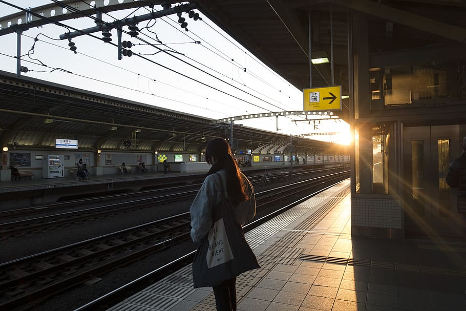 woman standing beside railway, Japan, Train Station, Tokyo HD wallpaper