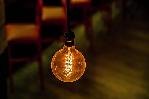shallow focus photography of lighted bulb, bokeh shot of orange LED light bulb HD wallpaper