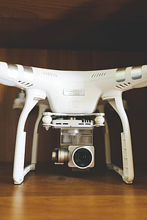 shallow focus white camera drone, white DJI Phantom Advance on brown surface HD wallpaper