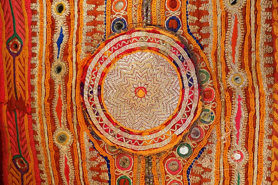flat lay photo of multicolored tapestry, embroidery, sheesha