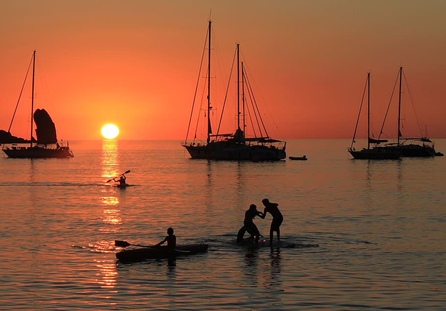 sunset, sea, silhouette, atmosphere, boats, backlight, canoeing HD wallpaper