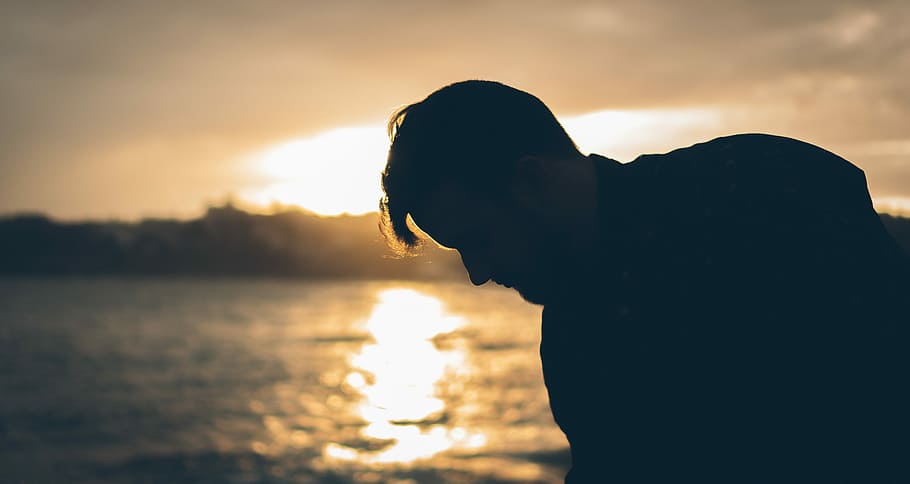 man standing near body of water during sunset, silhouette photo of man near body of water HD wallpaper