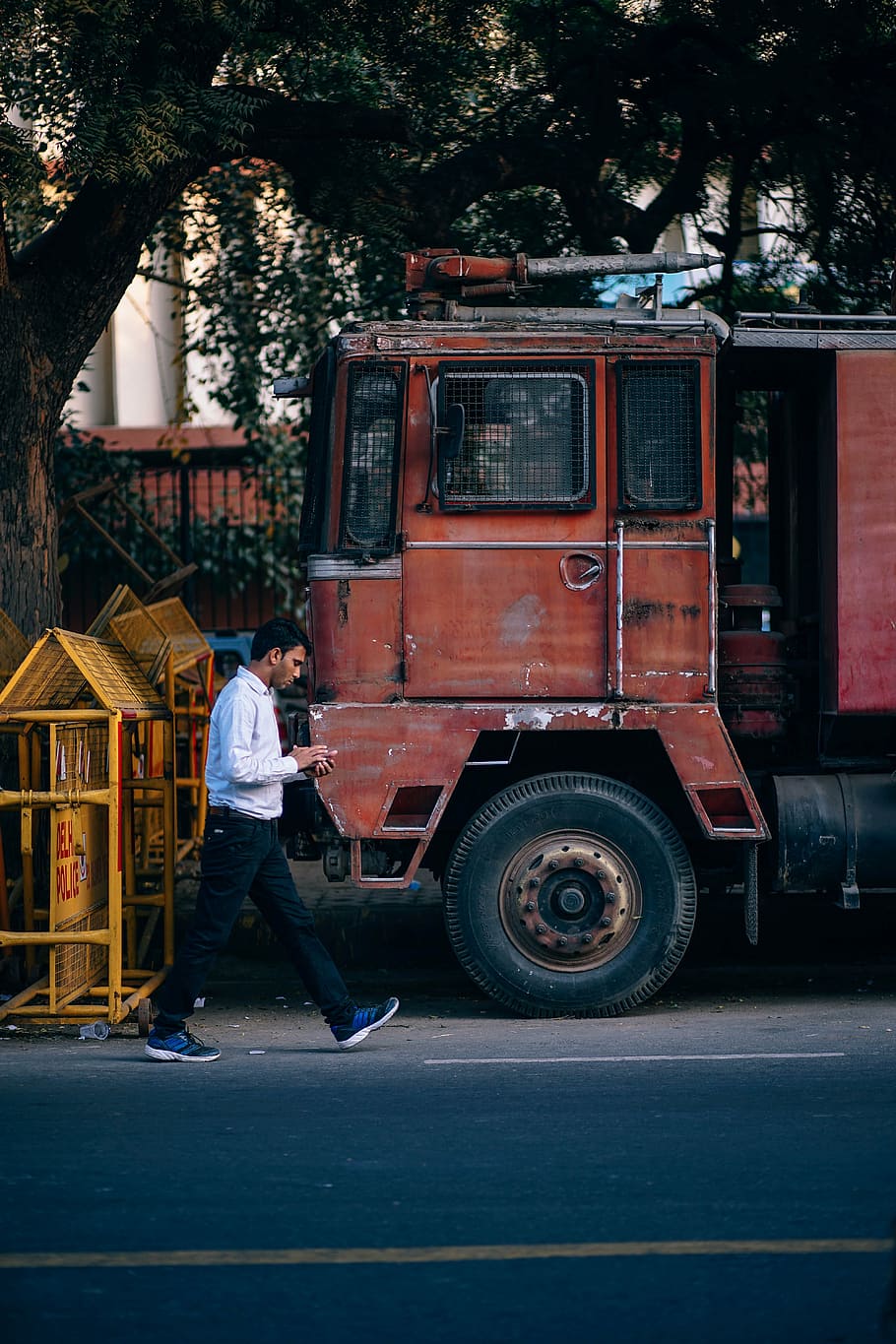 person walking beside red truck, alone, asian, bangladesh, book, HD wallpaper