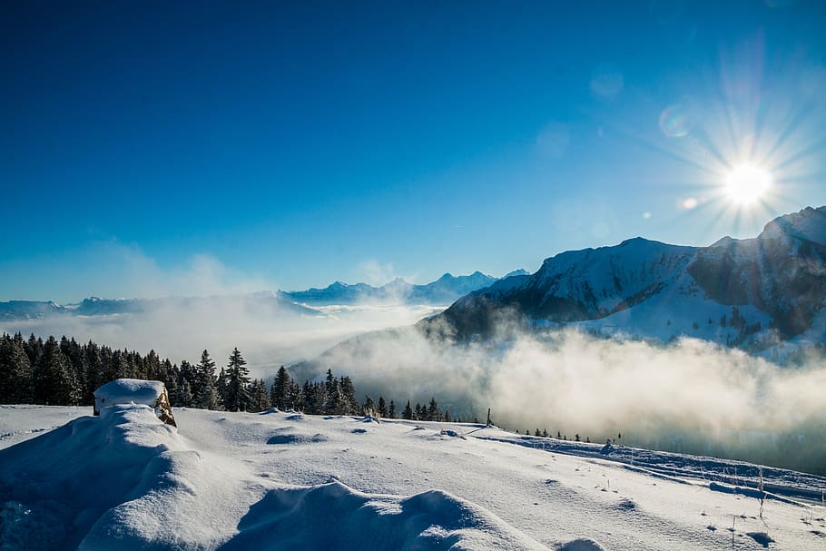 snow covered mountains during daytime, winter, sky, sun, fog
