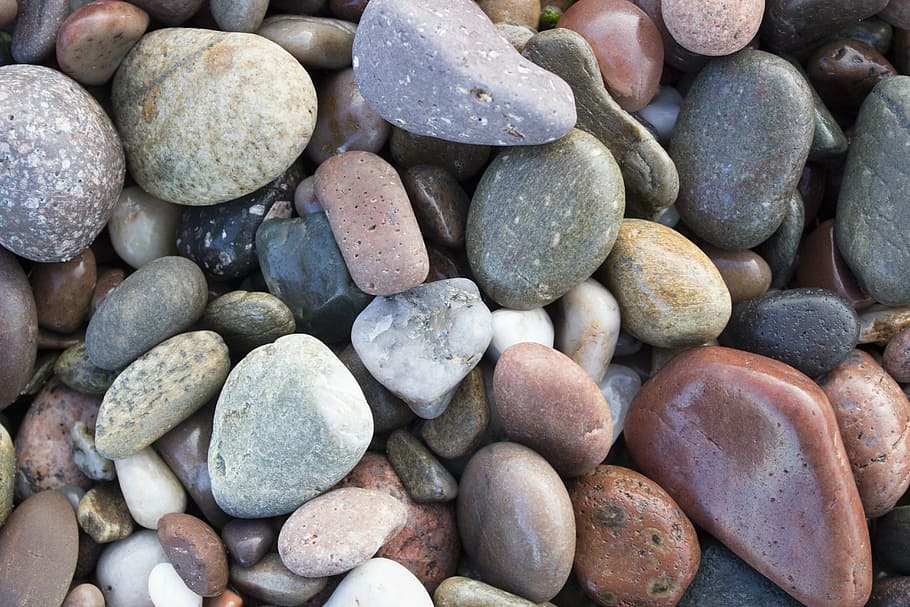rocks, beach, ocean, solid, pebble, stone - object, large group of objects HD wallpaper