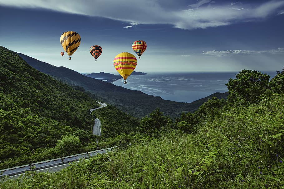 five assorted-color hot air balloon passing through mountains, HD wallpaper