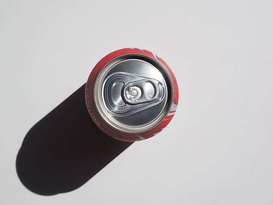 red beverage can on top of white surface, box, cola dose, supervision