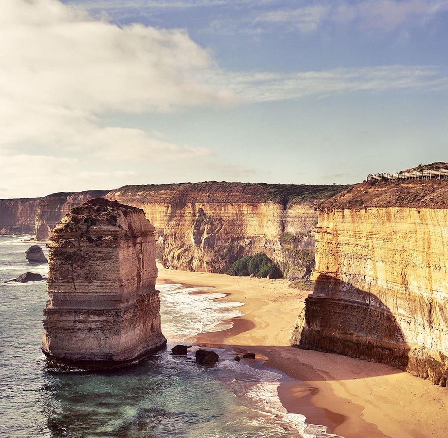 rock monolith landmark, coastline, cliffs, water, scenic, scenery HD wallpaper