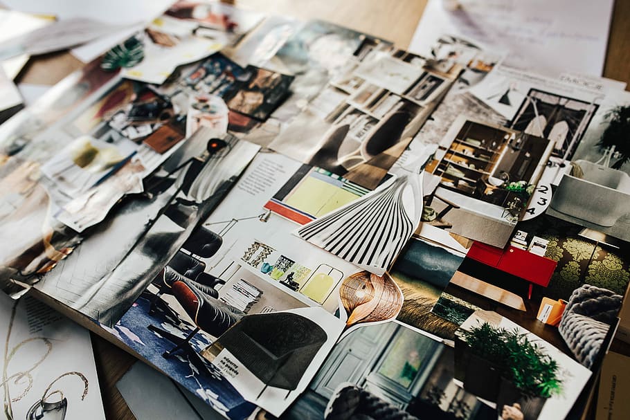 Designers working with material samples and paper cutouts, fabric HD wallpaper