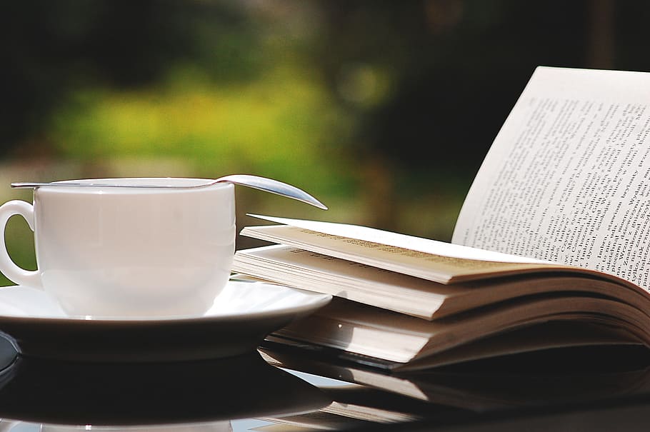 focus photography of white ceramic teacup next to book, nature, HD wallpaper