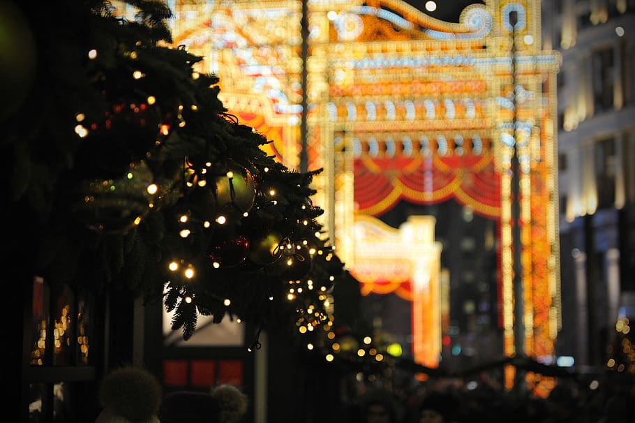 shallow focus photo of Holiday tree, white string lights and green baubles during nighttime HD wallpaper