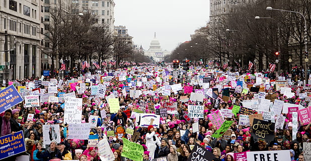 crowd of people holding placards, people rallying on the street during daytime HD wallpaper