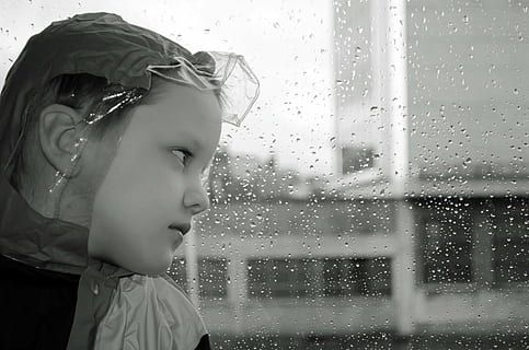 grayscale photo of girl looking thru glass window with water dew HD wallpaper