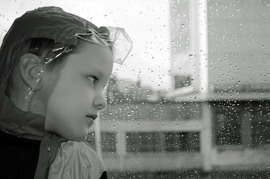 grayscale photo of girl looking thru glass window with water dew HD wallpaper