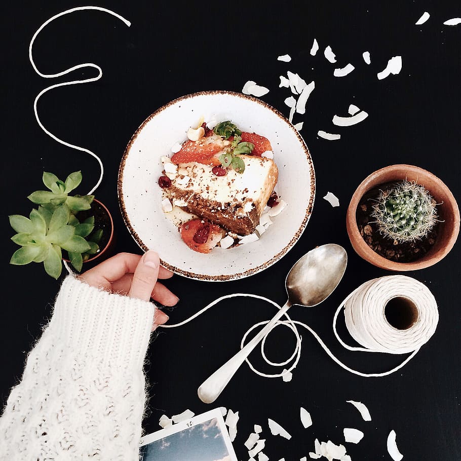Woman Touching White and Brown Ceramic Saucer With Strawberry Cake HD wallpaper