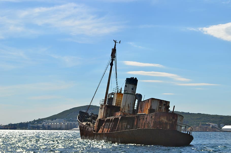 brown cargo ship on sea, boat, rust, shipwreck, pirate, asylum seeker HD wallpaper
