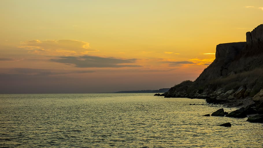 sea, sunset, beach, stones, landscape, evening, nature, sky HD wallpaper