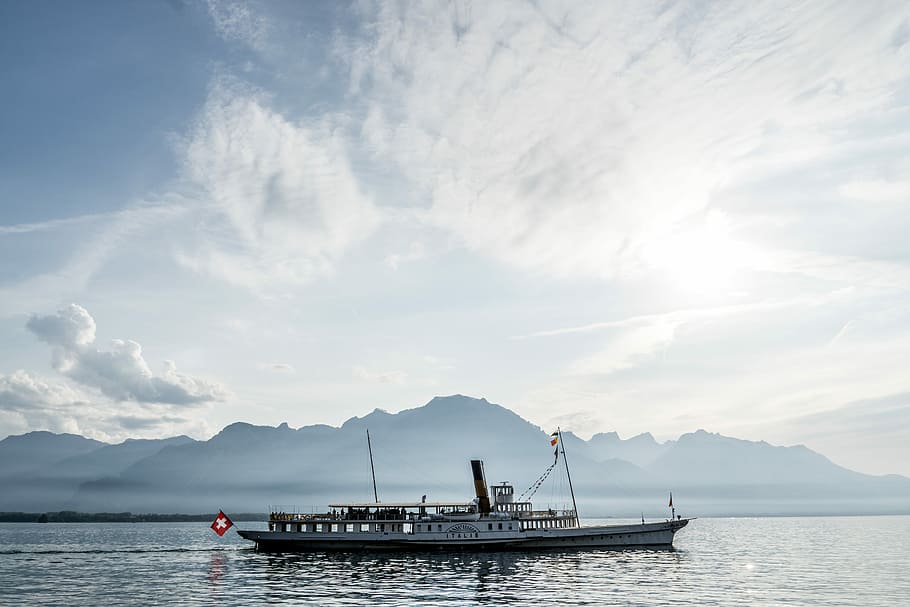 Lake Geneva, white and brown boat under cloudy sky during daytime HD wallpaper