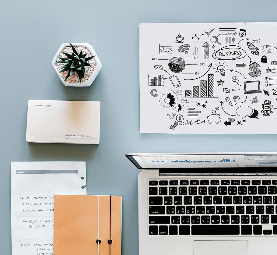 flat lay photography of MacBook beside printer paper and book HD wallpaper
