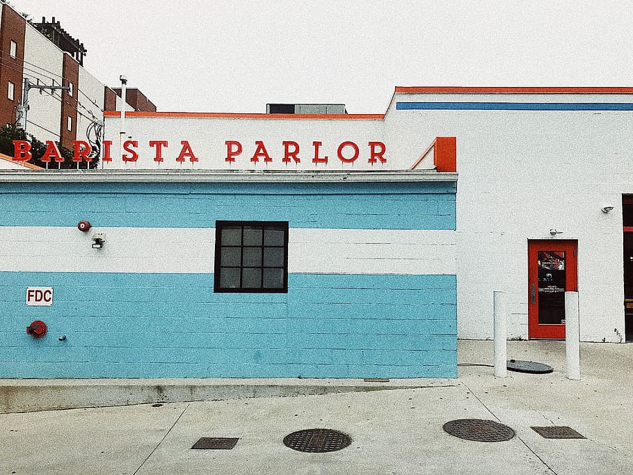 white and blue painted concrete building with Barista Parlor sign, Barista Parlor signage above blue and white building HD wallpaper
