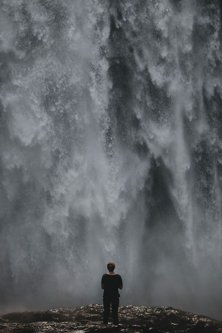 woman standing in front of waterfalls during daytime, person standing in front of waterfalls HD wallpaper