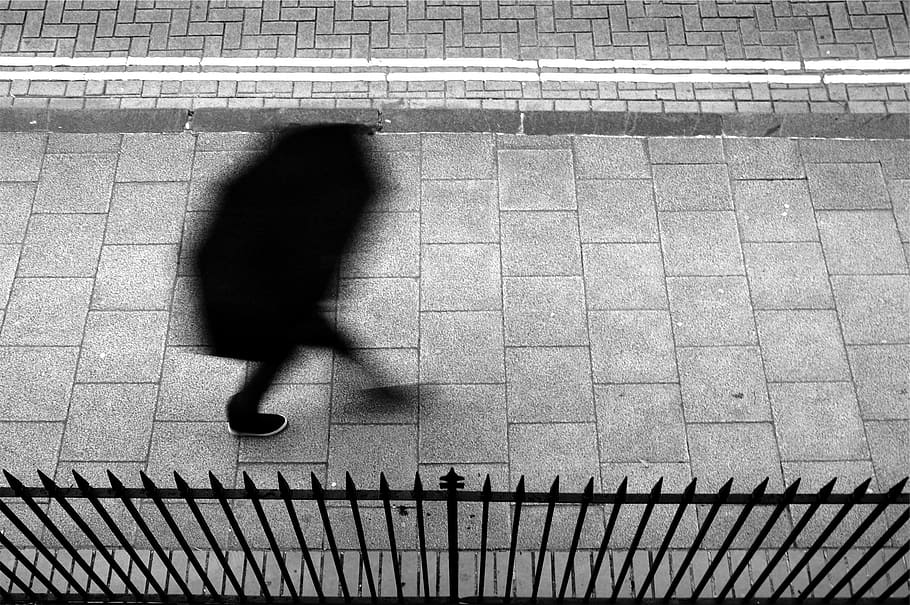 pedestrian, walking, umbrella, sidewalk, fence, people, blurred motion HD wallpaper