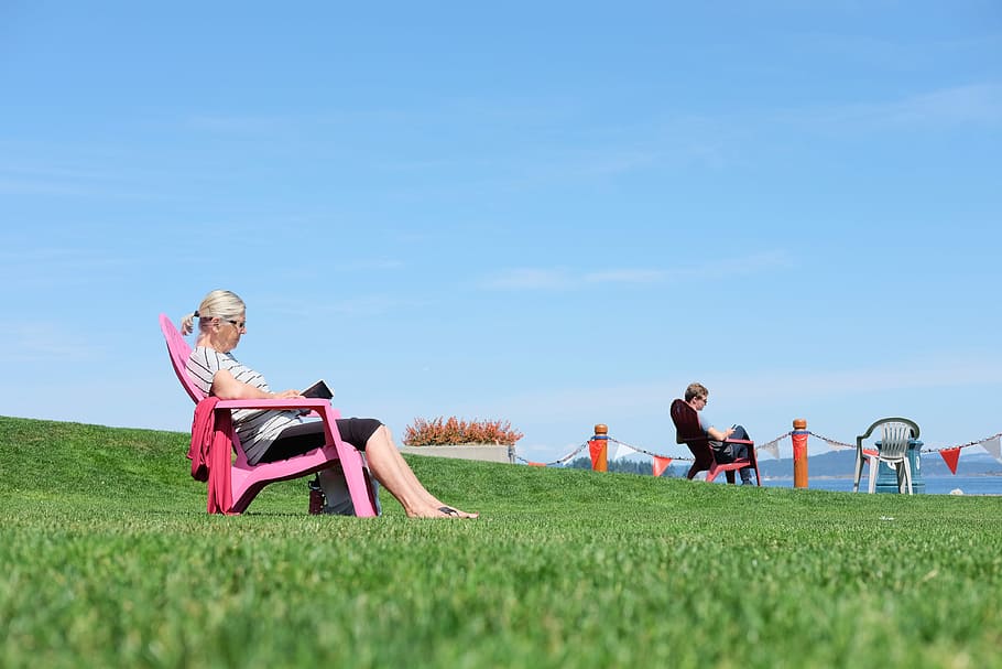 woman sitting chair outdoor during daytime, woman seating on armchair white reading HD wallpaper