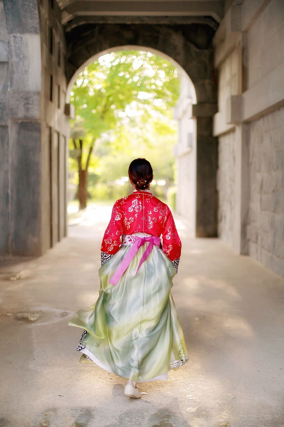 walking woman wearing red and grey traditional dress, korean