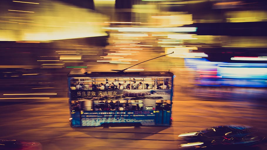 Double decker bus in motion moves through the night on Hong Kong Island, untitled HD wallpaper