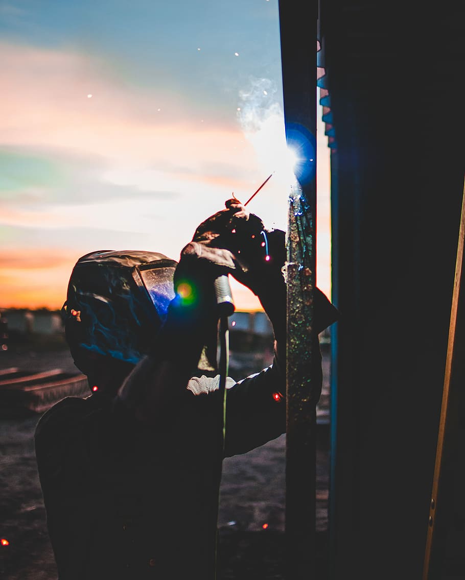 person welding bar, person welding the rod, welder, sunset, color, HD wallpaper