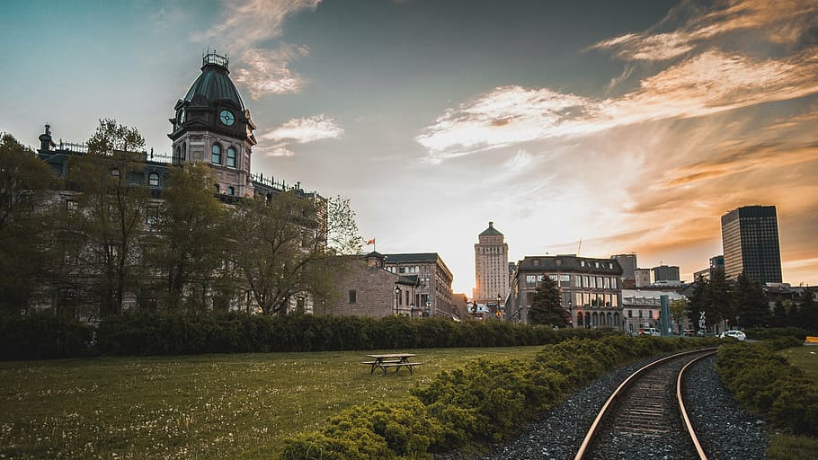 railroad near concrete buildings, track, train, green, grass HD wallpaper