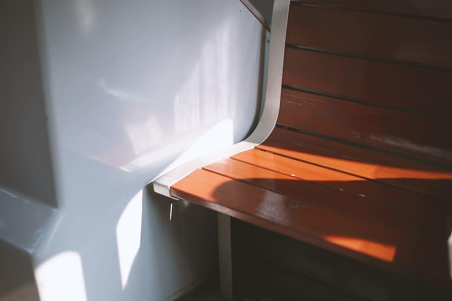 empty wooden chair near wall, empty bench beside wall, shadows HD wallpaper
