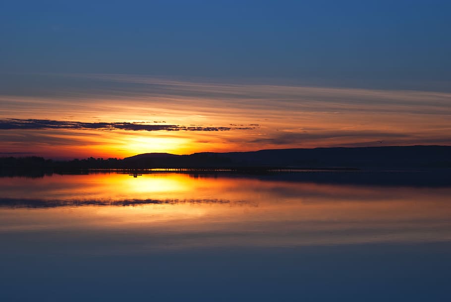 body of water under sunset, body of water and mountains during sunset HD wallpaper