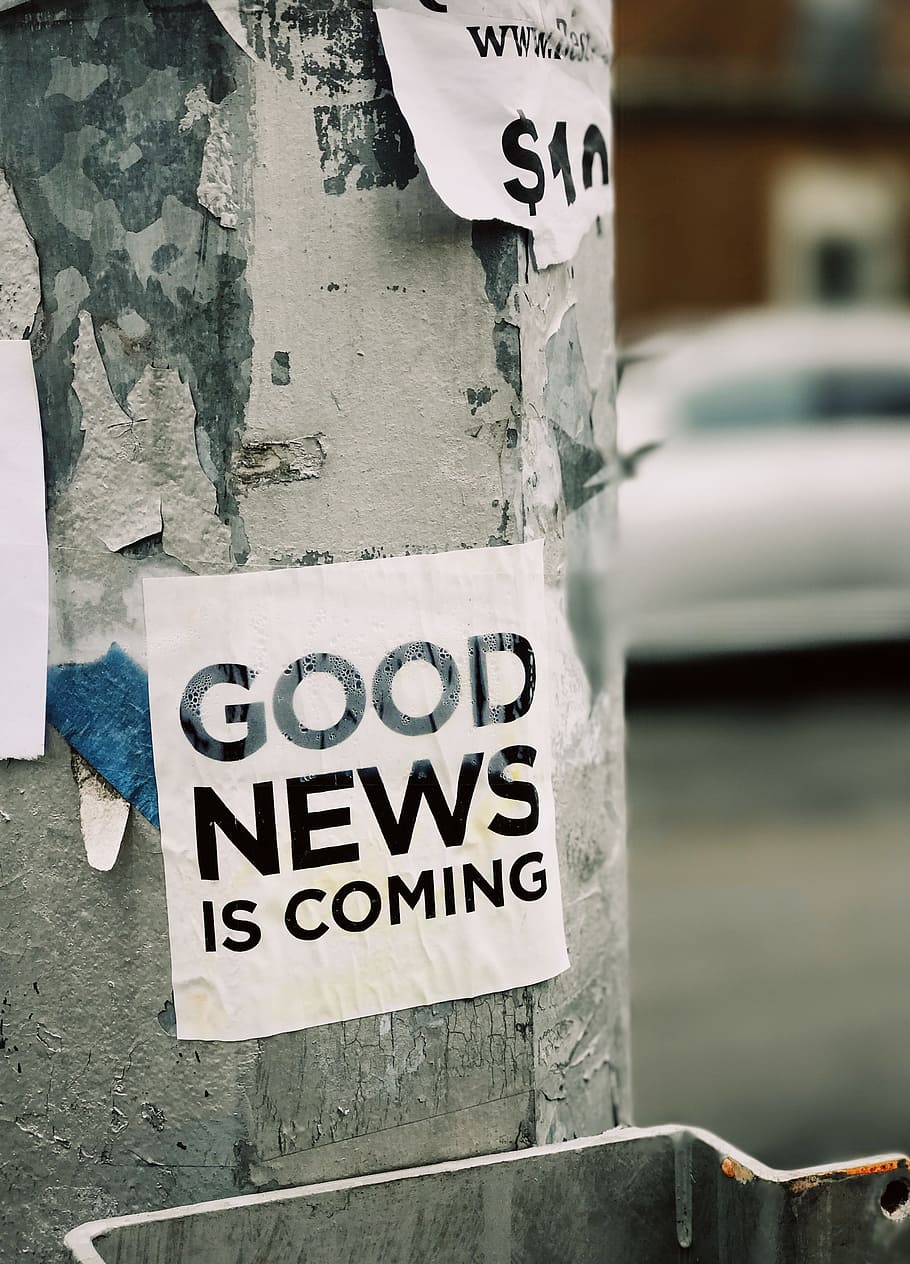 white Good News Is Coming paper on wall, white good news is coming printed paper mounted on gray post, HD wallpaper
