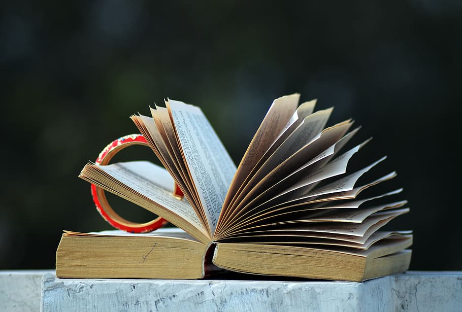 selective focus photography red bangle on opened book, open book HD wallpaper