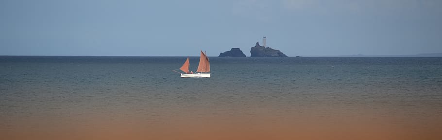 view of boat in ocean, Beach, Godrevy, St Ives, porthkidney beach
