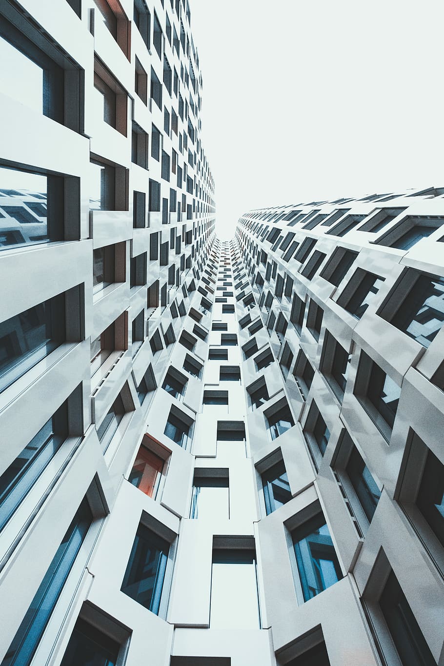 closeup photo of gray concrete building, low angle photo of white high-rise building HD wallpaper