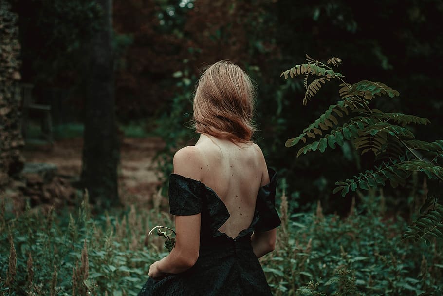selective focus photography of woman standing on forest, woman wearing black sleeveless in the middle of forest, HD wallpaper