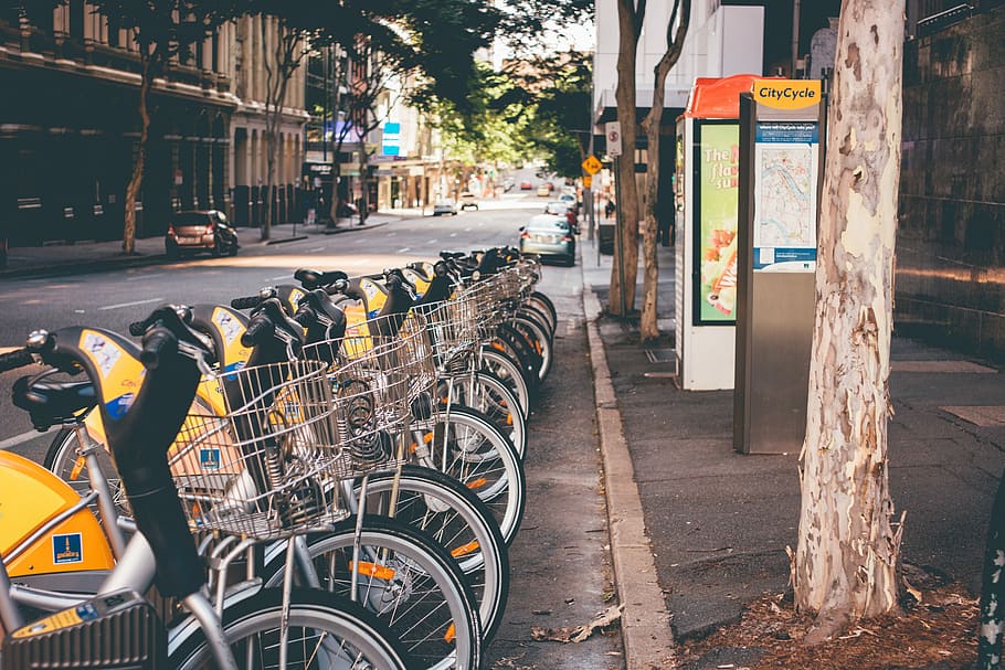 person showing parked utility scooter, bicycle, street, urban Scene HD wallpaper